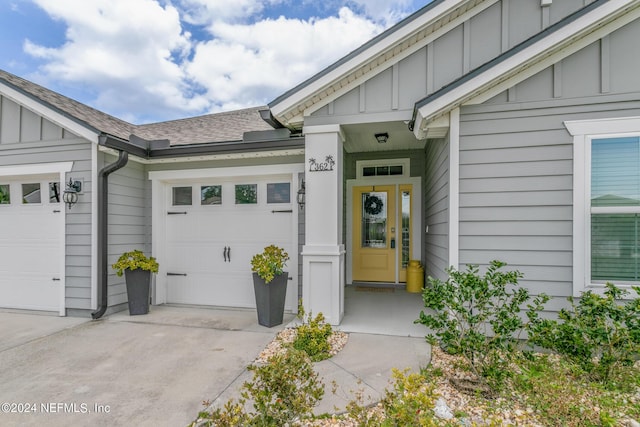 view of exterior entry with a garage