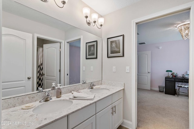 bathroom with vanity and a textured ceiling