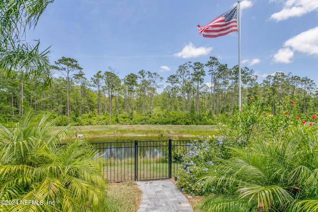 view of gate featuring a water view