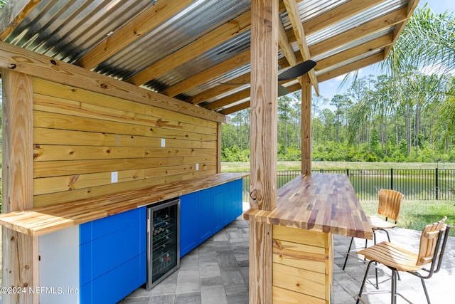 view of patio featuring wine cooler