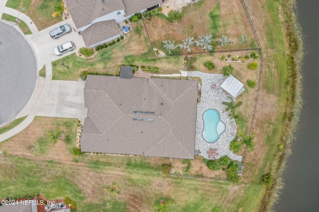 birds eye view of property featuring a water view