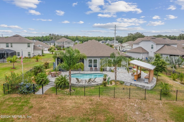 view of pool featuring a patio and a lawn