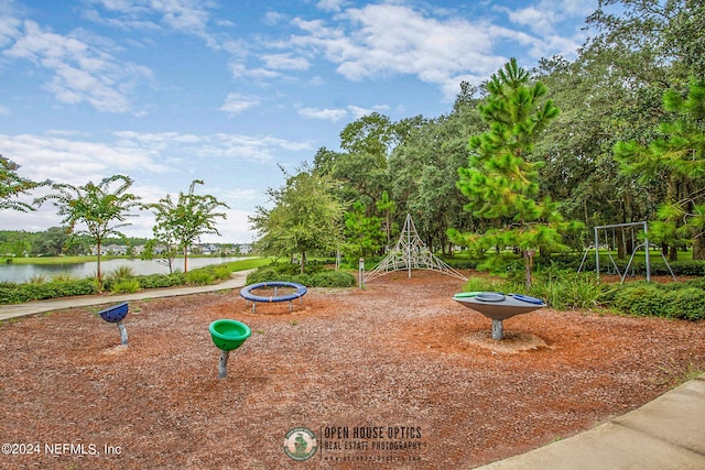 view of property's community featuring a playground and a water view