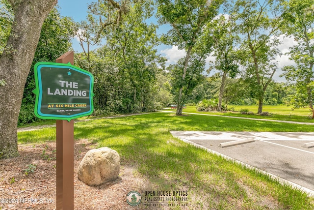 surrounding community featuring a lawn