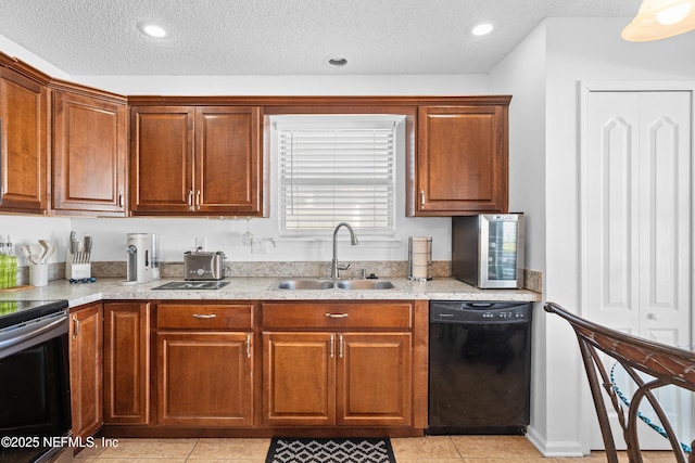 kitchen featuring stainless steel range with electric stovetop, a textured ceiling, sink, light tile patterned floors, and black dishwasher