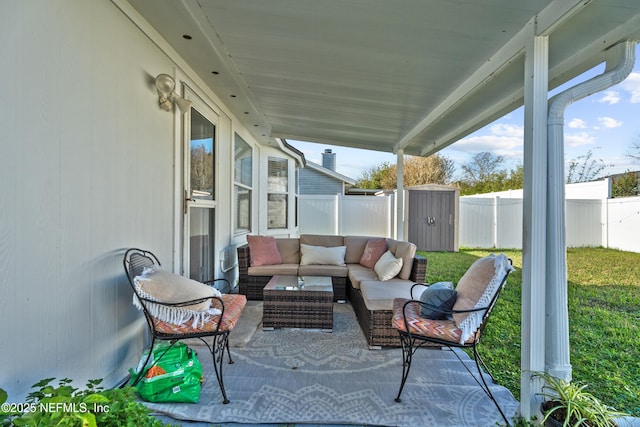 view of patio / terrace featuring outdoor lounge area and a storage unit