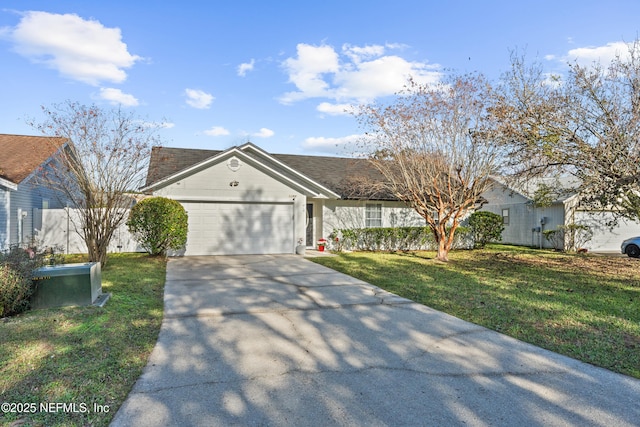 single story home featuring a garage and a front lawn