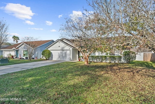 ranch-style home featuring a garage and a front lawn