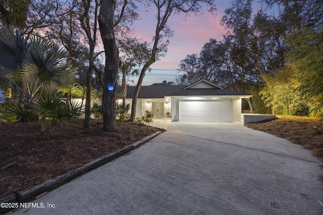 single story home with a garage