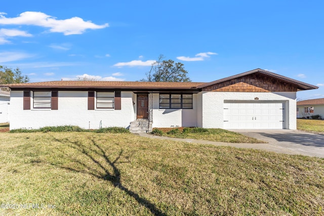 ranch-style home with a front lawn and a garage