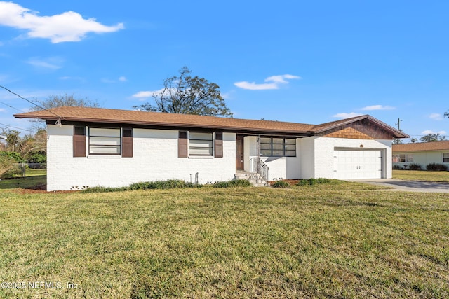 single story home featuring a garage and a front lawn