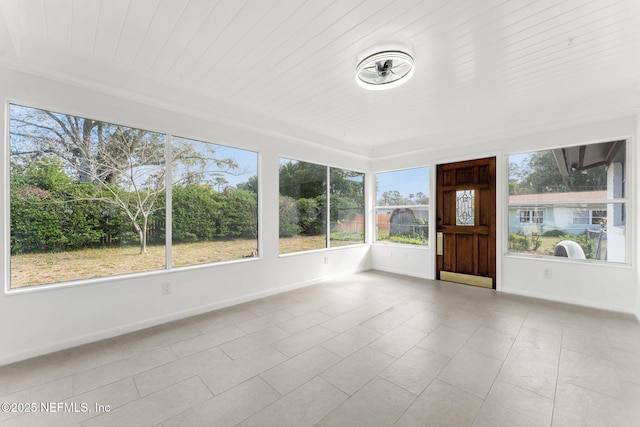 unfurnished sunroom featuring wood ceiling