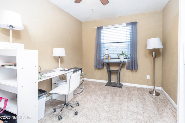 home office featuring ceiling fan and carpet