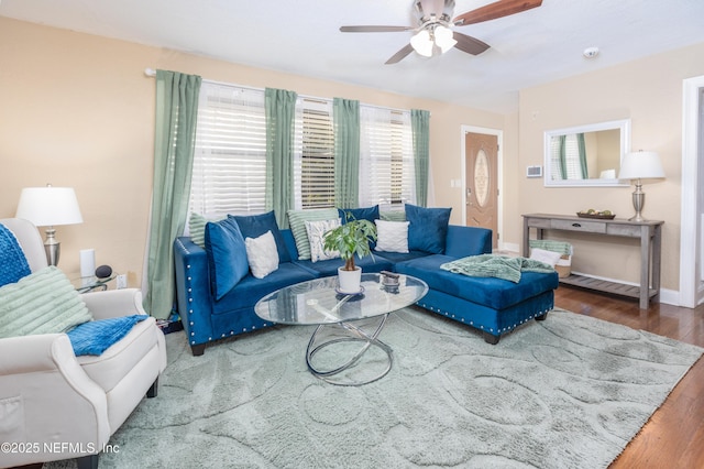 living room with ceiling fan and hardwood / wood-style floors