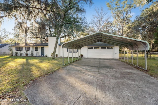 ranch-style house featuring a carport, a garage, and a front yard