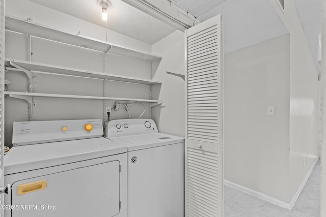 laundry area with independent washer and dryer