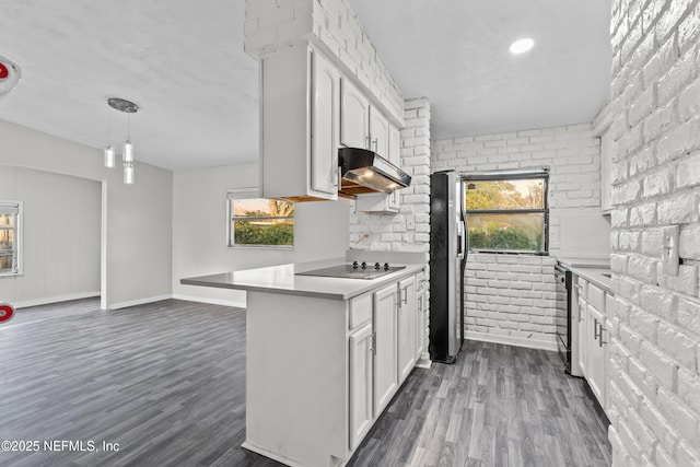 kitchen featuring white cabinetry, a wealth of natural light, and black electric stovetop