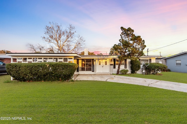 view of front of home with a yard