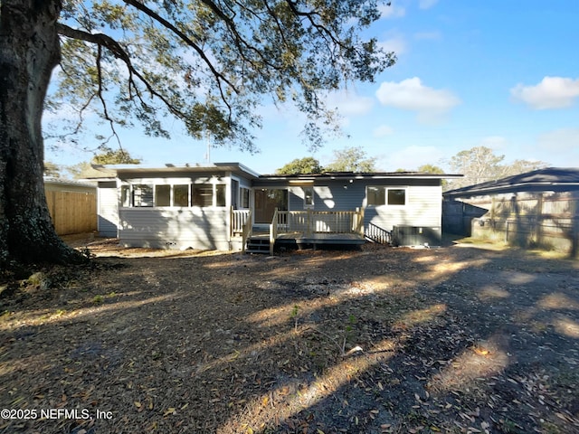 rear view of property with a deck