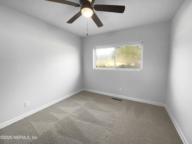 unfurnished room with carpet flooring, a textured ceiling, and ceiling fan