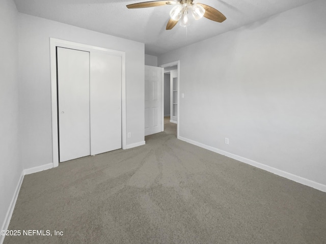 unfurnished bedroom with carpet flooring, a closet, and ceiling fan