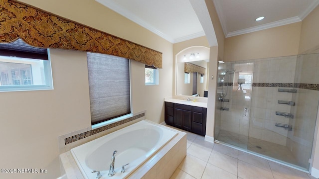 bathroom with tile patterned flooring, shower with separate bathtub, vanity, and ornamental molding