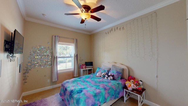 carpeted bedroom with ceiling fan and ornamental molding