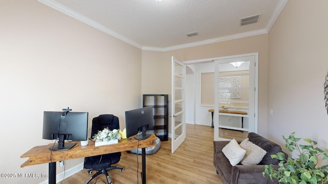 office area with french doors, ornamental molding, built in shelves, a textured ceiling, and light hardwood / wood-style flooring