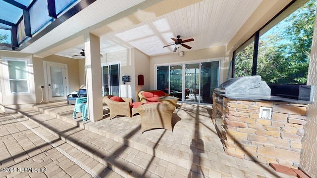 view of patio / terrace with an outdoor kitchen and ceiling fan