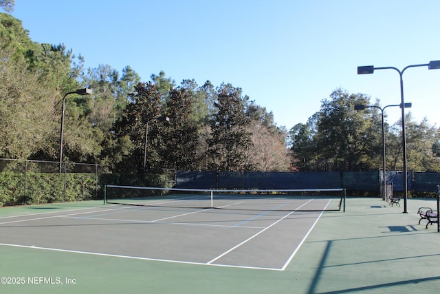 view of sport court featuring basketball hoop