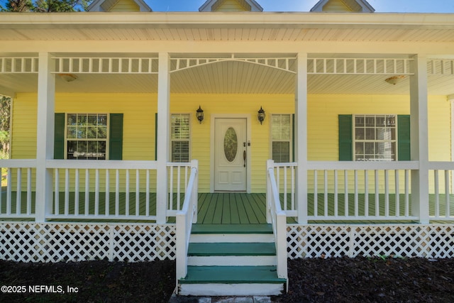 entrance to property featuring covered porch