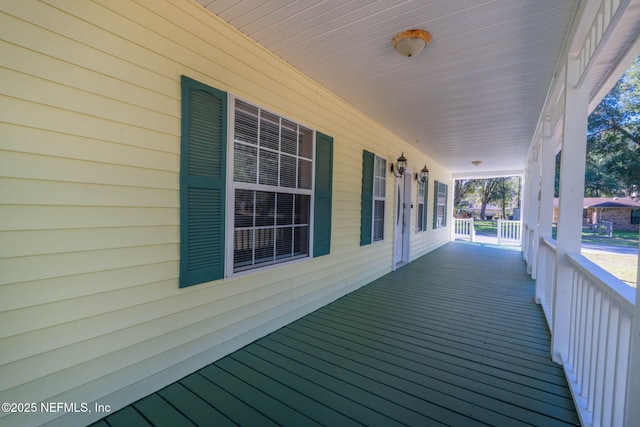 wooden deck featuring covered porch