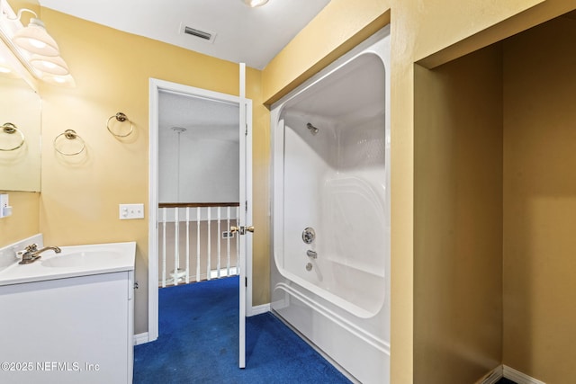 bathroom featuring vanity and washtub / shower combination