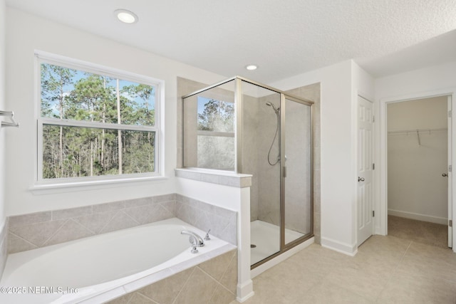 bathroom with tile patterned floors and plus walk in shower