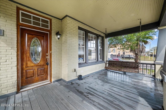 property entrance featuring covered porch