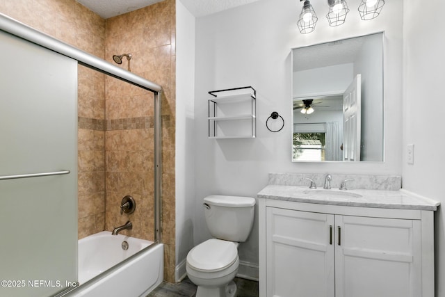 full bathroom featuring a textured ceiling, enclosed tub / shower combo, vanity, toilet, and ceiling fan