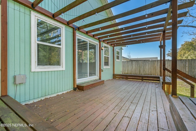 wooden deck featuring a pergola