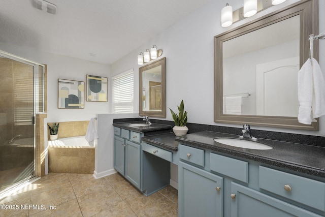 bathroom with independent shower and bath, vanity, and tile patterned floors