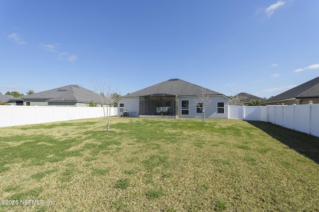 rear view of house with a lawn