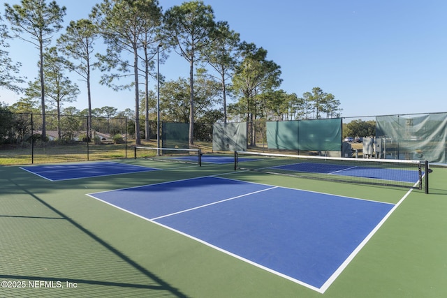 view of tennis court featuring basketball court