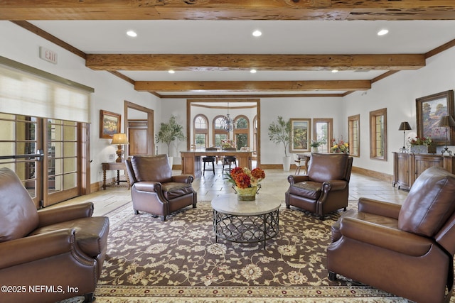 living room with beam ceiling and french doors