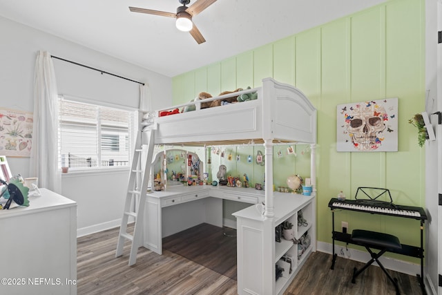 bedroom with a ceiling fan and wood finished floors