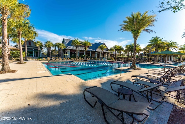 community pool with a patio area