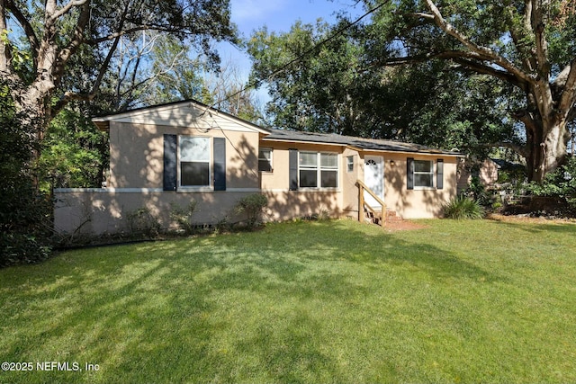 ranch-style home featuring a front yard