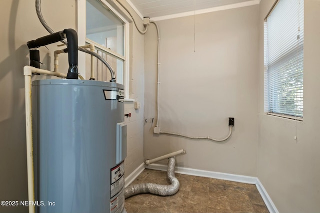 utility room featuring water heater