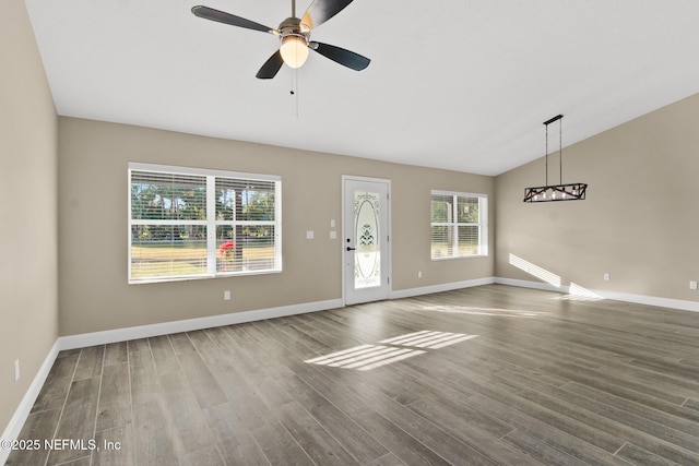 unfurnished living room featuring ceiling fan, wood-type flooring, and vaulted ceiling