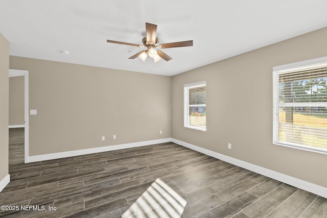 unfurnished room featuring dark hardwood / wood-style floors and ceiling fan