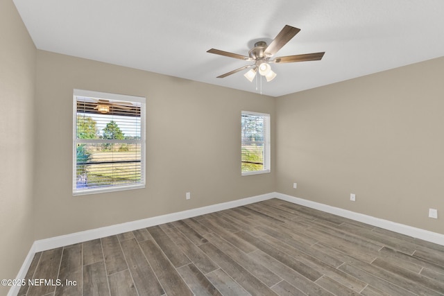 empty room featuring ceiling fan and wood-type flooring