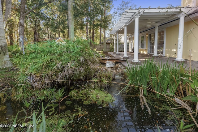 view of yard with a pergola and a patio