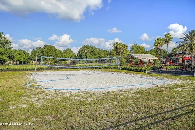 view of property's community featuring a playground, a yard, volleyball court, and a gazebo